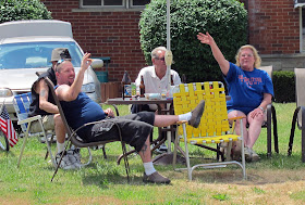 party parade watcher, drinking, smoking, waving