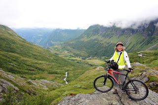 Janie Robinson biking Geirangerfjord, Norway. Photograph by Brian Quinn, Travel Writer