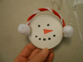 Snaowman ornament from a plastic lid