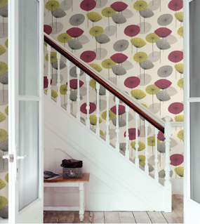 green and purple wallpaper on stairwell - dandelion clocks pattern