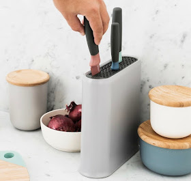 oval knife block with an insert at the top to hold knives in place