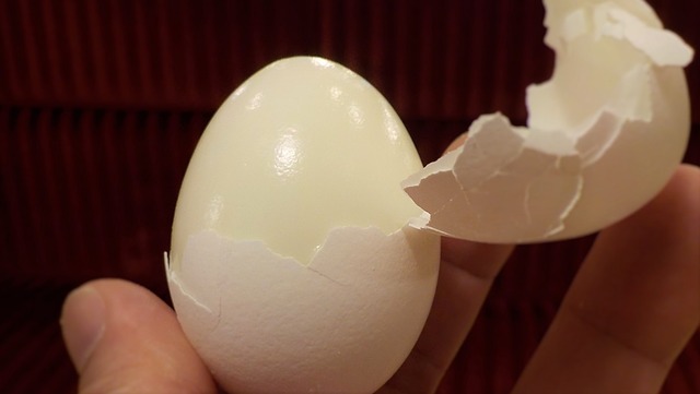 Hard Boiled Egg Being Peeled