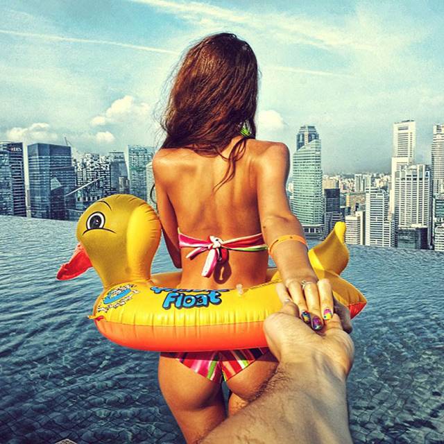 Photographer Murad Osmann creatively documents his travels around the world with his girlfriend leading the way in his ongoing series known as Follow Me To. Chronicling his adventures on Instagram, the Russian photographer composes each shot in a similar fashion. We see each landscape from the photographer's point of view with his extended hand holding onto his girlfriend's in front of him.