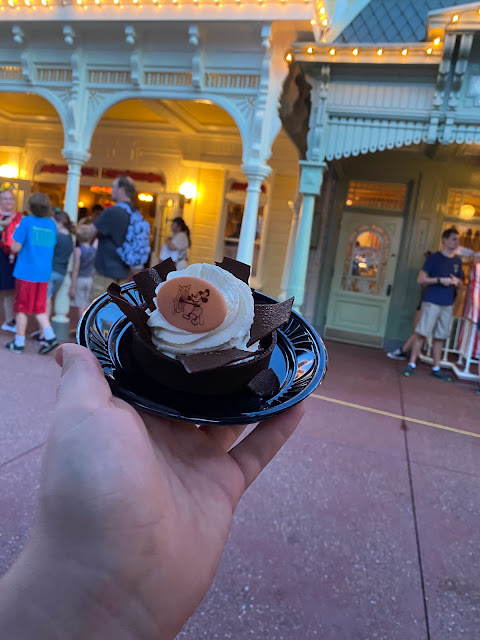 Hand Holding Chocolate Pressed Penny Silk Magic Kingdom