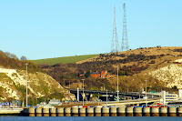 Two masts of Second World War Swingate Chain Home Radar Station, ex-RAF Swingate, now Swingate Transmitting Station. Also: Coastguard Cottages, Broadlees Bottom, A2 Jubilee Way bypass, White Cliffs of Dover, Eastern Docks, Dover harbour from Prince of Wales pier.