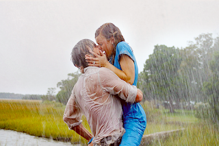 couple hugging and very romantic kiss in rain