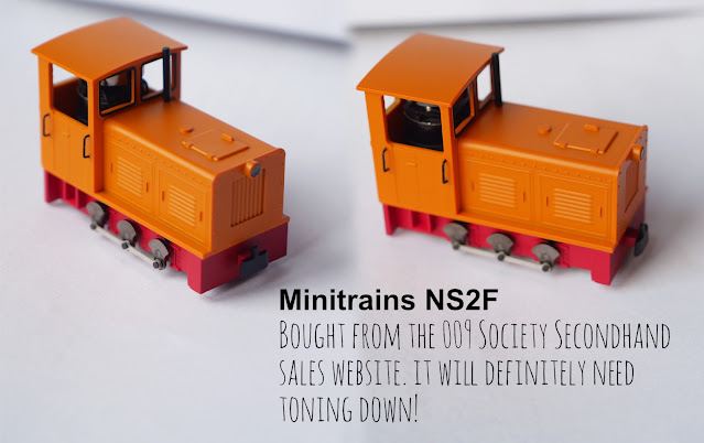 A 6-coupled Minitrains N2SF diesel locomotive, sporting a very bright orange livery!