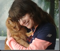 Cheryl focing her affections on the cat.