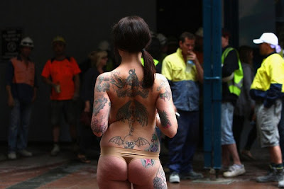 Tattooed Model Stands For PETA Protest