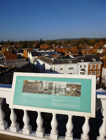 Looking north from the rooftop of Abingdon County Hall Museum. Among the images on the display board is a crowd scene from the 2011 Bun Throwing. It was great to be able to pick us out in the crowd too