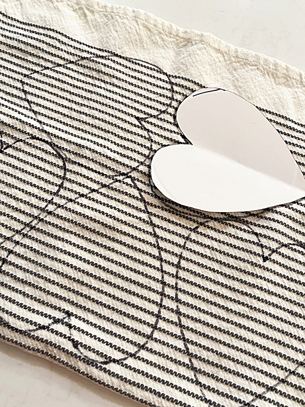 heart pattern traced on tea towel