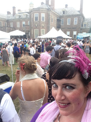 People waiting in food truck lines at the Roaring Twenties Lawn Party in Ipswich, Massahusetts