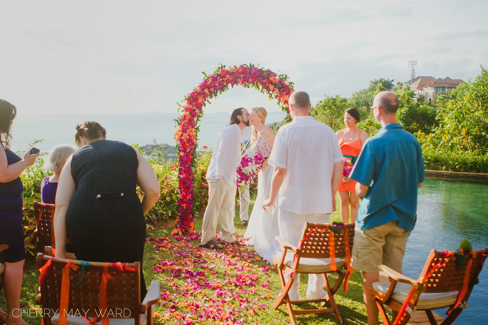 Koh Samui intimate wedding ceremony, bride and groom kiss on the cheek, Thailand wedding ceremony, small wedding in Thailand, wedding with a view, beautiful destination wedding with a view