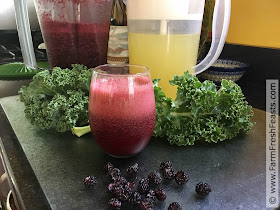 photo of raspberry kale lemonade slushy in a glass
