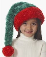 http://www.yarnspirations.com/patterns/child-s-santa-hat.html