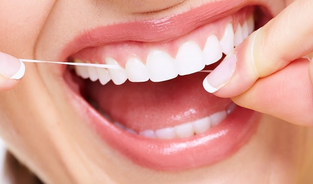 reasons floss every day dental health