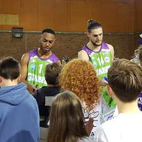 Manchester Giants Basketball squad signing autographs for children