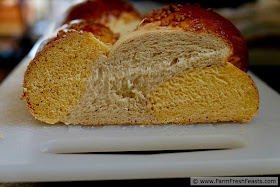 cross section of a braided loaf of orange sweet potato & pecan bread