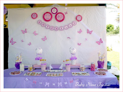 mesa dulce bautizo primer añito mariposas fucsia lila