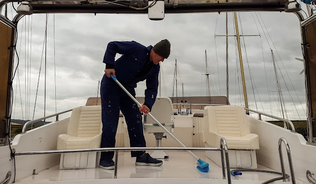 Photo of scrubbing the deck of the fly bridge 