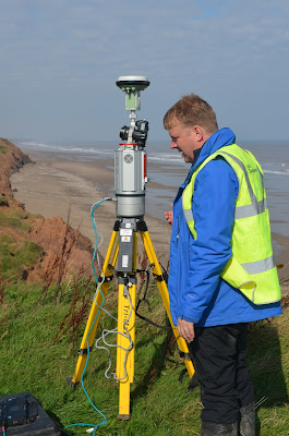 Matt Kirkham, Geotechnical Soils Lab Specialist,  carrying out Terrestrial LiDAR survey at the  Coastal Landslide Observatory,  Aldbrough, East Riding of Yorkshire