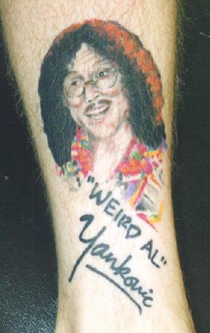rick ross tattoos on his hand. really bad tattoos. rick ross