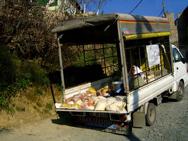 Potato seller in village.