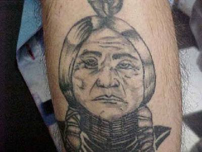 Comments: black and gray realistic native american tattoo