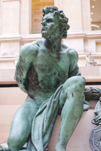 One of the "Four Captives" in gilt-bronze by Martin Desjardins This represents the Defeated Nation of Holland