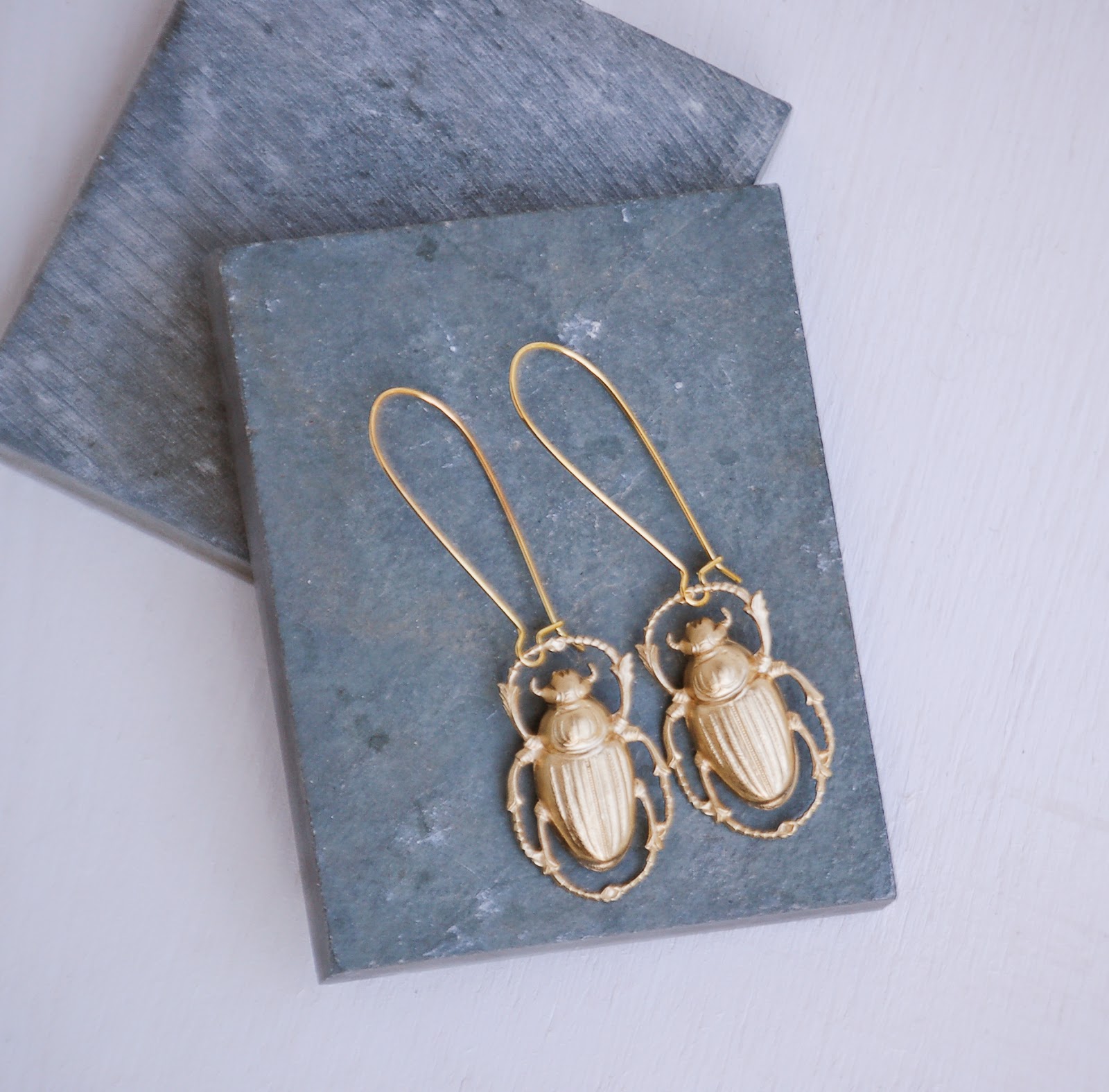 https://www.etsy.com/listing/226803713/gold-beetle-earrings-nature-study?ref=shop_home_active_2&ga_search_query=beetle