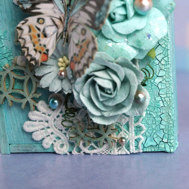 mixed media project made with Reneabouqets butterfly, chipboard, beautiful beads pearls, lace, paper flowers; Tim Holtz Distress Spray Stain salvaged patina and speckled egg, Distress Oxide Spray, Distress Glaze weathered wood; Scrapbook.com Pops of Color seafoam; Prima Marketing flower