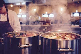 Two big pots in kitchen steaming