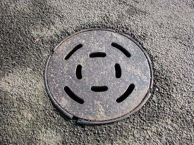 Metal cover on the street, Astoria, Oregon