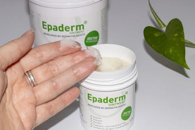 A hand with Epaderm Ointment on showing the consistency of the ointment