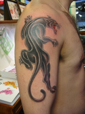 Long Panther on shoulder tattoo.