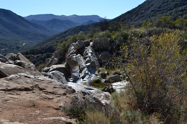 wide V of rock at the top of the waterfall