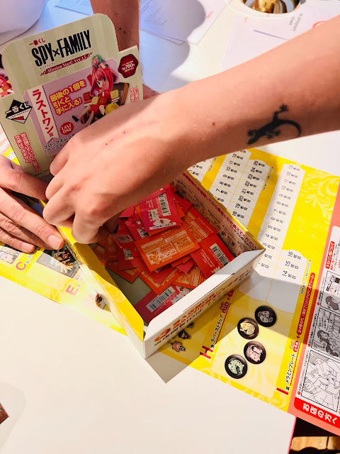 hand reaching for Ichibankuji ticket in box