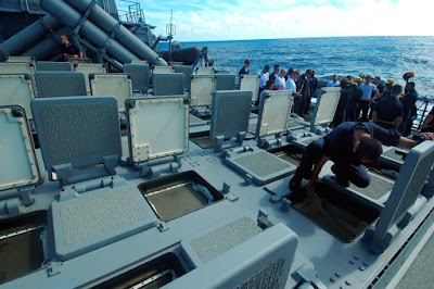 Open hatches of a Mk 41 Vertical Launch System missile launcher aboard an Arleigh Burke-class guided missile destroyer