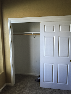 Before photo of office closet with carpet and old paint