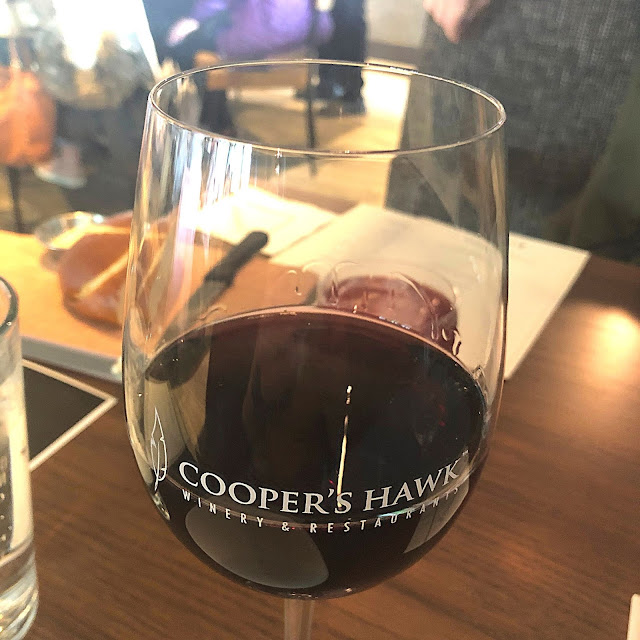 Sipping and swirling Cooper's Hawk Barbera.