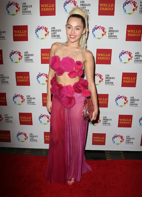 Do You Have a Photo of Miley Cyrus in a Pink Outfit? Here's Everything You Need to Know!