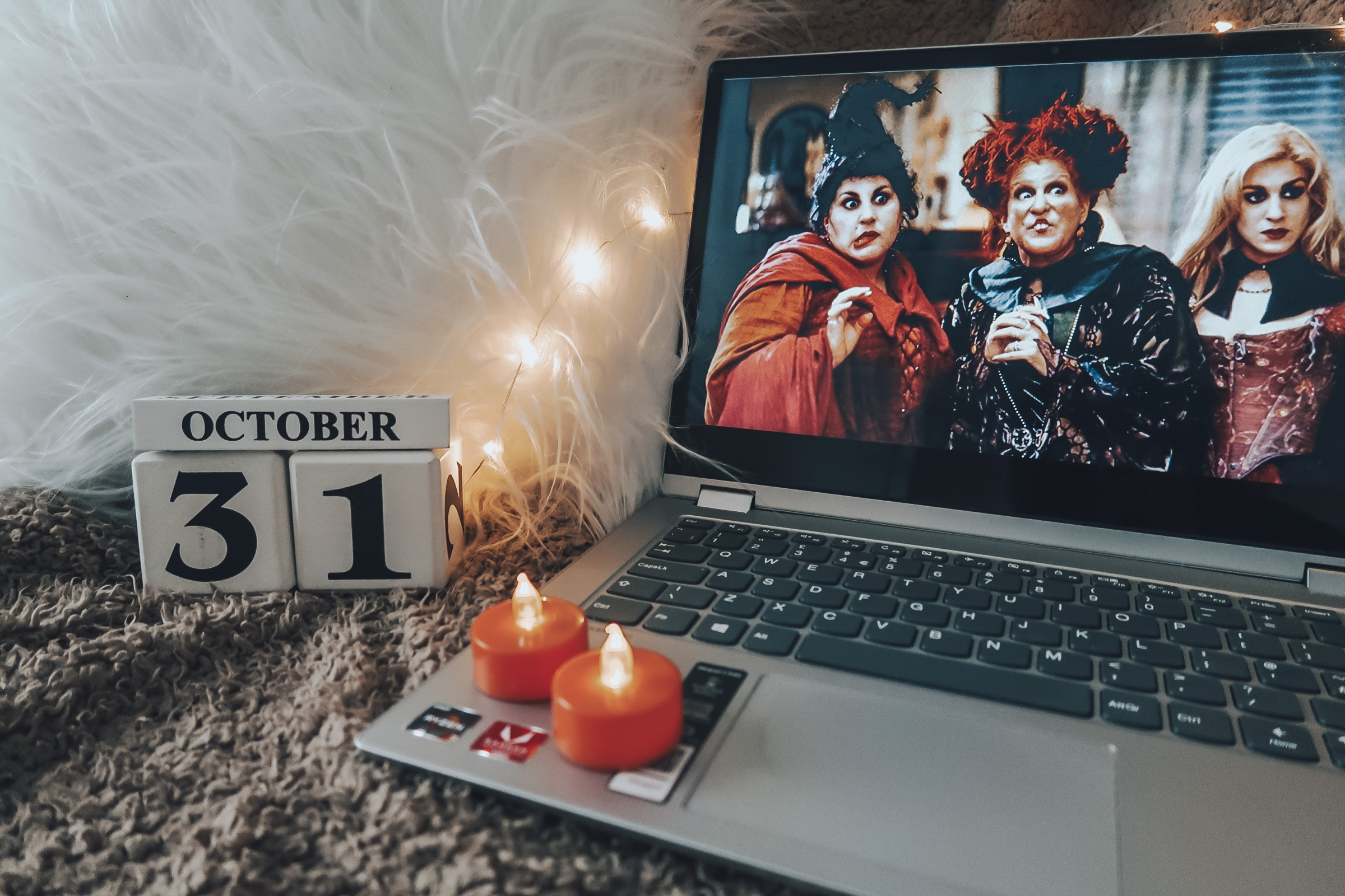 A laptop with Halloween themed movie, Hocus Pocus, on the screen