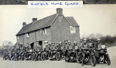 Home Guard motorcyclists pose in uniform.