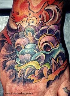 Balinese barong mask tattoo on hand