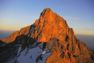 The peak of Mount Kenya just at the sunrise over the mountain proves to be the most breathtaking scene for Mount Kenya Climbing Expeditions group  tour