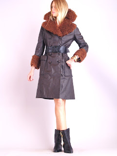 Vintage 1970's brown leather coat with front button closure and large mongolian fur trim collar.