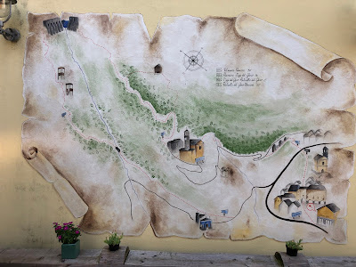 A mural in Vilminore showing trail to the Gleno Dam.