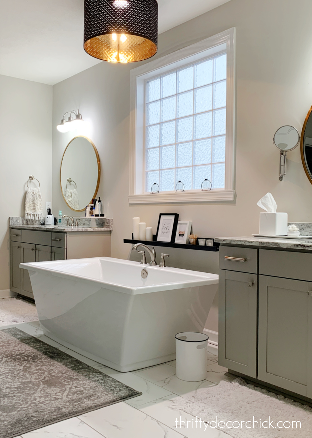 master bath with tub between sinks