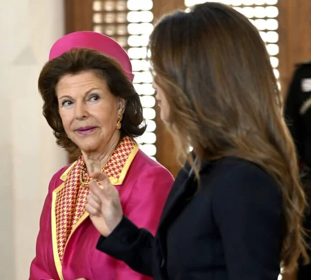 King Carl Gustaf and Queen Silvia, King Abdullah, Queen Rania. Silvia wore a fuchsia coat and houndstooth dress