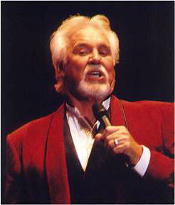 Microphone in hand, Kenny Rogers sings